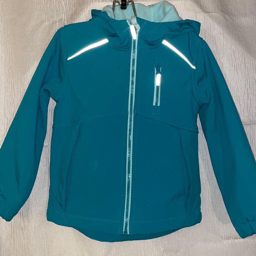 Teal green kid’s jacket with reflective strips
